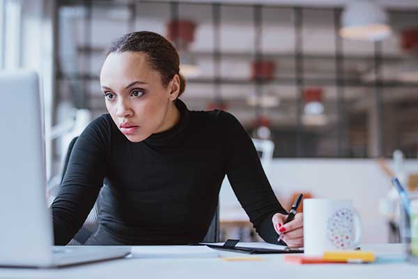 F101_FranchisingSuccess Woman Working at Computer