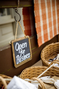 60896574 - open for business slate sign at a vintage looking shop